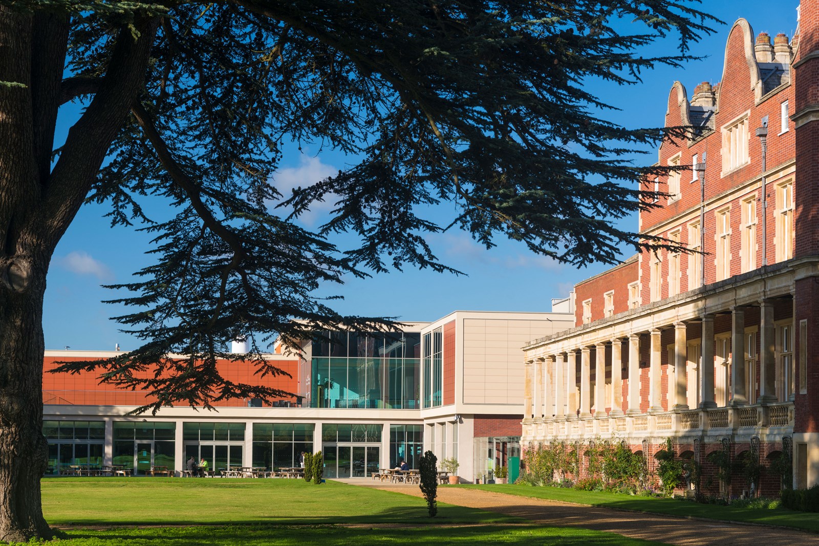 A grand brick building on grass that is part of the Babraham Research Campus