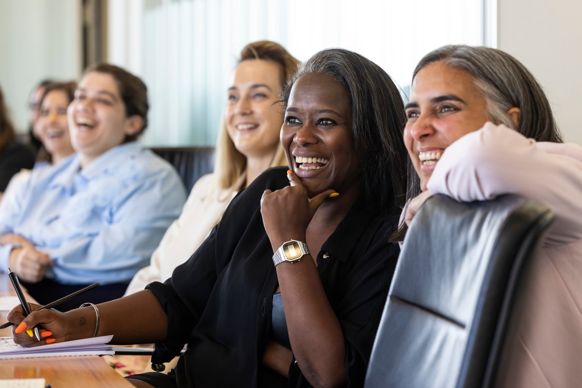 Two female LifeArc fellows laughing together